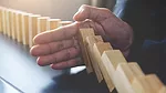 Stopping Dominoes