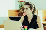 Woman sitting at a desk Woman sitting at a desk